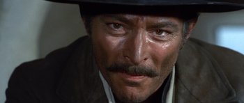 Movie still from “The Good, the Bad and the Ugly” (1966), directed by Sergio Leone – A person wearing a hat; Close Up shot, Low angle