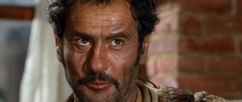 Movie still from “The Good, the Bad and the Ugly” (1966), directed by Sergio Leone – A person with a beard; Close Up shot, Low angle