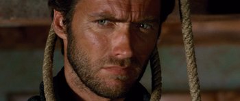 Movie still from “The Good, the Bad and the Ugly” (1966), directed by Sergio Leone – A man's face with a rope around his neck; Close Up shot, Low angle