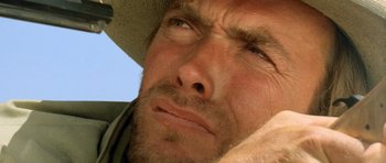 Movie still from “The Good, the Bad and the Ugly” (1966), directed by Sergio Leone – A person wearing a hat; Extreme Close Up shot, Low angle