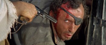 Movie still from “The Good, the Bad and the Ugly” (1966), directed by Sergio Leone – A person holding a pair of scissors; Close Up shot, High angle