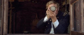 Movie still from “The Good, the Bad and the Ugly” (1966), directed by Sergio Leone – A man taking a picture of himself with a camera; Close Up shot, Over the shoulder angle