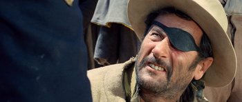 Movie still from “The Good, the Bad and the Ugly” (1966), directed by Sergio Leone – A person wearing a cowboy hat; Close Up shot, Low angle