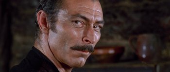 Movie still from “The Good, the Bad and the Ugly” (1966), directed by Sergio Leone – A person with a mustache; Close Up shot, Low angle