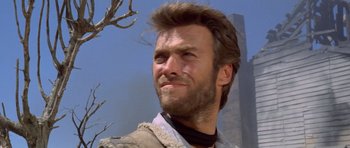 Movie still from “The Good, the Bad and the Ugly” (1966), directed by Sergio Leone – A person with a beard; Close Up shot, Low angle