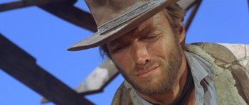 Movie still from “The Good, the Bad and the Ugly” (1966), directed by Sergio Leone – A person wearing a cowboy hat; Close Up shot, Low angle