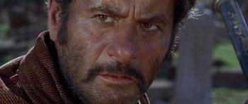 Movie still from “The Good, the Bad and the Ugly” (1966), directed by Sergio Leone – A man's face with dirt on his face; Close Up shot, Low angle