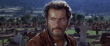 Movie still from “The Good, the Bad and the Ugly” (1966), directed by Sergio Leone – An old man with a beard and a mustache; Close Up shot, Low angle