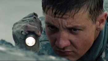 Movie still from “The Hurt Locker” (2008), directed by Kathryn Bigelow – A person holding a flashlight; Close Up shot, Low angle