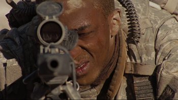 Movie still from “The Hurt Locker” (2008), directed by Kathryn Bigelow – A man with a gun in his face; Extreme Close Up shot, Low angle
