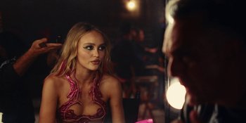 Movie still from “The Idol” (2023), directed by Sam Levinson – A woman is looking at herself in the mirror; Close Up shot, Over the shoulder angle