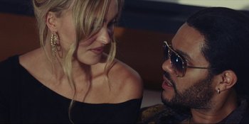 Movie still from “The Idol” (2023), directed by Sam Levinson – A man and a woman are looking at one another; Close Up shot, Over the shoulder angle