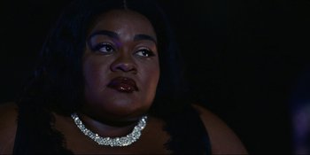 Movie still from “The Idol” (2023), directed by Sam Levinson – A person wearing a necklace; Close Up shot, Low angle