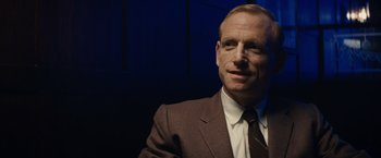 Movie still from “Bridge of Spies” (2015), directed by Steven Spielberg – A person wearing a suit and tie; Close Up shot, Low angle