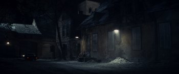 Movie still from “Bridge of Spies” (2015), directed by Steven Spielberg – An empty street at night in the dark; Extreme Wide shot, High angle