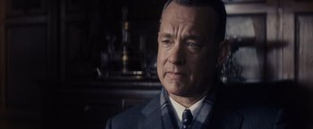 Movie still from “Bridge of Spies” (2015), directed by Steven Spielberg – A man in a suit and tie looking at the camera; Close Up shot, Over the shoulder angle