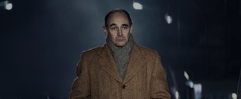 Movie still from “Bridge of Spies” (2015), directed by Steven Spielberg – A man in a brown coat and a scarf; Close Up shot, Low angle
