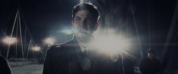 Movie still from “Bridge of Spies” (2015), directed by Steven Spielberg – A person wearing a suit and tie; Close Up shot, Low angle