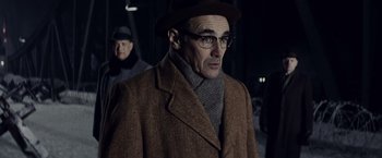 Movie still from “Bridge of Spies” (2015), directed by Steven Spielberg – An old man wearing glasses and a hat; Close Up shot, Low angle