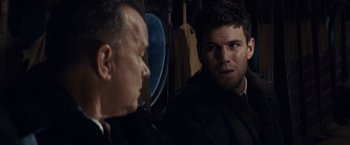 Movie still from “Bridge of Spies” (2015), directed by Steven Spielberg – A man looking at another man in a suit; Close Up shot, Over the shoulder angle