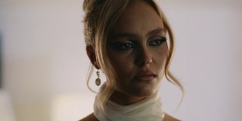Movie still from “The Idol” (2023), directed by Sam Levinson – A person wearing a white dress; Close Up shot, Low angle