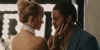 Movie still from “The Idol” (2023), directed by Sam Levinson – A man and a woman looking at one another; Close Up shot, Over the shoulder angle