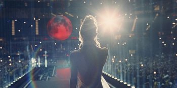 Movie still from “The Idol” (2023), directed by Sam Levinson – A woman standing in front of a stage with lights; Wide shot, High angle