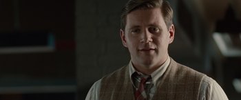 Movie still from “The Imitation Game” (2014), directed by Morten Tyldum – A person wearing a vest and a tie; Close Up shot, Over the shoulder angle