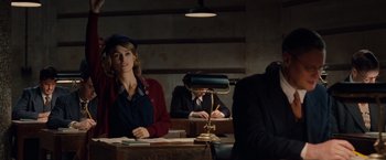 Movie still from “The Imitation Game” (2014), directed by Morten Tyldum – A woman sitting at a table in front of two men; Medium shot, Over the shoulder angle