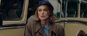 Movie still from “The Imitation Game” (2014), directed by Morten Tyldum – Keira knightley wearing a hat; Close Up shot, Over the shoulder angle