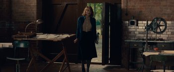 Movie still from “The Imitation Game” (2014), directed by Morten Tyldum – A woman standing in front of an open door; Medium shot, Over the shoulder angle