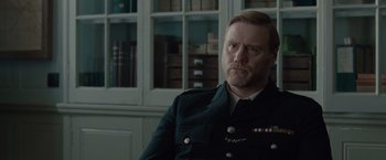 Movie still from “The Imitation Game” (2014), directed by Morten Tyldum – A person wearing a uniform; Close Up shot, Low angle