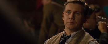 Movie still from “The Imitation Game” (2014), directed by Morten Tyldum – A person wearing a suit and tie; Close Up shot, Over the shoulder angle