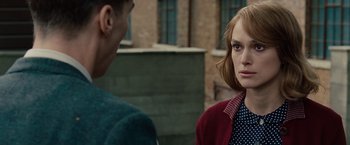 Movie still from “The Imitation Game” (2014), directed by Morten Tyldum – A woman and a man standing next to each other outside; Close Up shot, Over the shoulder angle