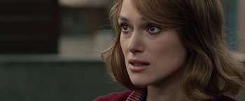 Movie still from “The Imitation Game” (2014), directed by Morten Tyldum – A person wearing a red jacket; Close Up shot, Over the shoulder angle