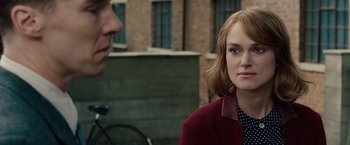 Movie still from “The Imitation Game” (2014), directed by Morten Tyldum – A man and a woman standing next to each other on the street; Close Up shot, Over the shoulder angle