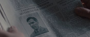 Movie still from “The Imitation Game” (2014), directed by Morten Tyldum – An old newspaper with a picture of an older man; Extreme Close Up shot, Overhead angle