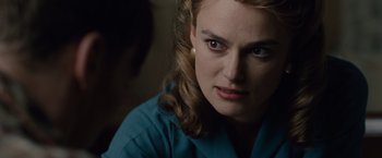 Movie still from “The Imitation Game” (2014), directed by Morten Tyldum – A person wearing a blue shirt; Close Up shot, Over the shoulder angle