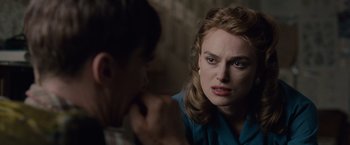 Movie still from “The Imitation Game” (2014), directed by Morten Tyldum – A woman sitting in front of another woman; Close Up shot, Over the shoulder angle