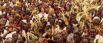 Movie still from “The Last King of Scotland” (2006), directed by Kevin Macdonald – A large group of people are gathered together; Wide shot, High angle