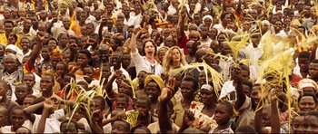 Movie still from “The Last King of Scotland” (2006), directed by Kevin Macdonald – A large group of people are gathered in a crowd; Wide shot, High angle