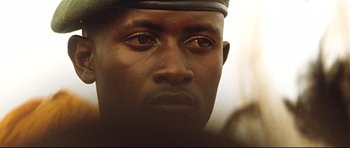 Movie still from “The Last King of Scotland” (2006), directed by Kevin Macdonald – A man's face in a military uniform; Extreme Close Up shot, Low angle