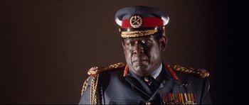 Movie still from “The Last King of Scotland” (2006), directed by Kevin Macdonald – A person wearing a military uniform; Close Up shot, Low angle