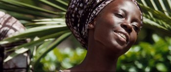 Movie still from “The Last King of Scotland” (2006), directed by Kevin Macdonald – A person wearing a headscarf; Close Up shot, Low angle