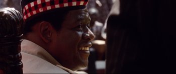 Movie still from “The Last King of Scotland” (2006), directed by Kevin Macdonald – A person wearing a hat; Close Up shot, Low angle