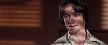 Movie still from “The Last King of Scotland” (2006), directed by Kevin Macdonald – A person wearing a jacket; Close Up shot, Low angle