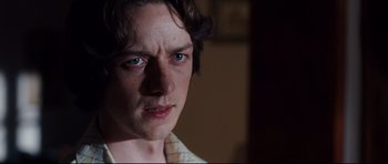 Movie still from “The Last King of Scotland” (2006), directed by Kevin Macdonald – A person with blue eyes; Close Up shot, Over the shoulder angle