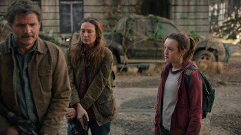 Movie still from “The Last of Us” (2023), created by Neil Druckmann – A group of people standing next to each other on the street; Medium shot, Over the shoulder angle