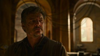 Movie still from “The Last of Us” (2023), created by Neil Druckmann – A person wearing a shirt; Close Up shot, Low angle