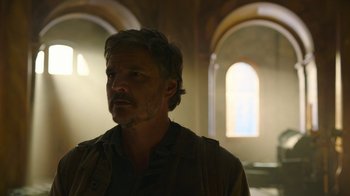 Movie still from “The Last of Us” (2023), created by Neil Druckmann – A man with a goatee standing in a room; Close Up shot, Low angle